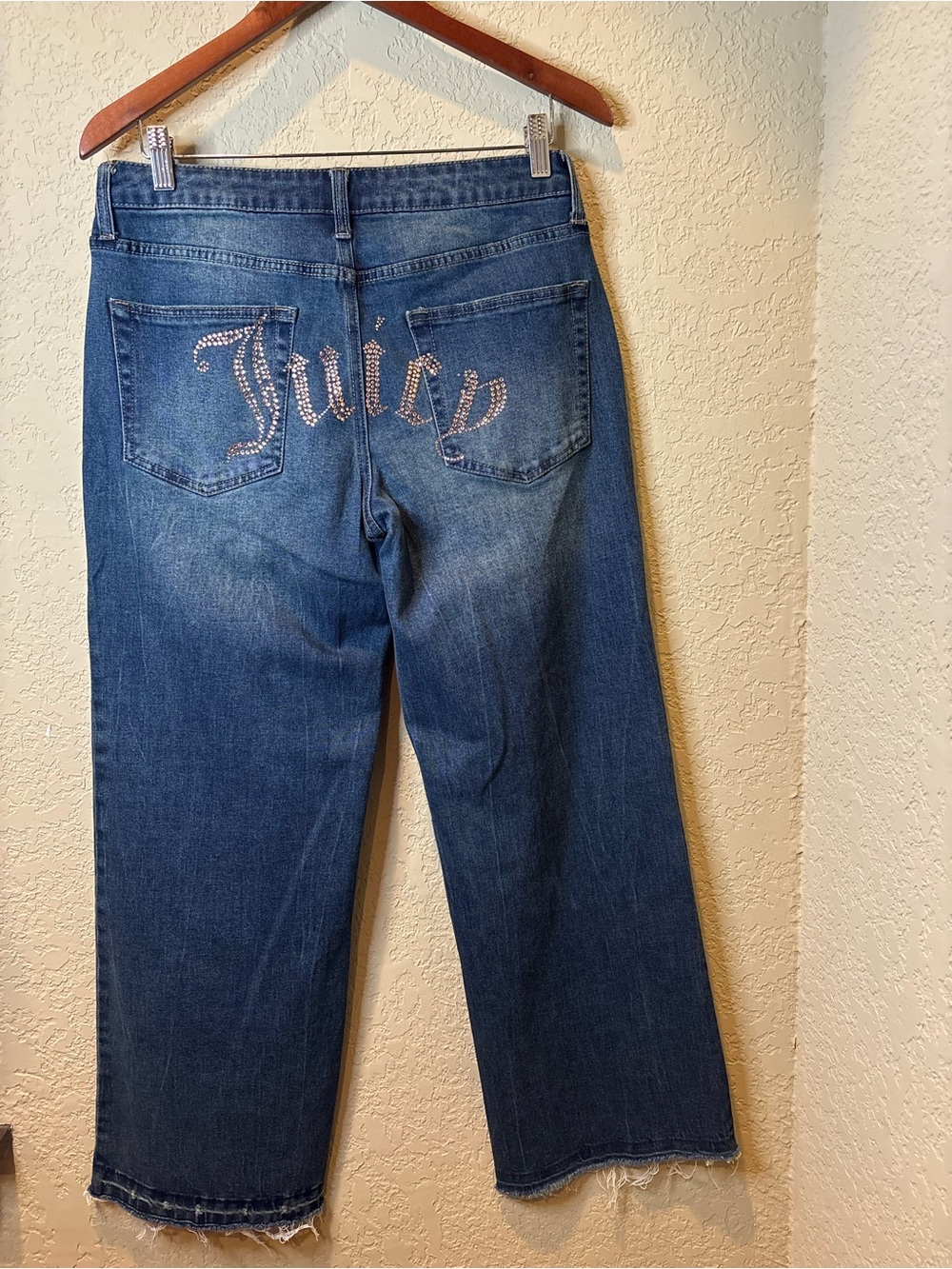 Juicy Couture blue denim jeans with rhinestone logo on back